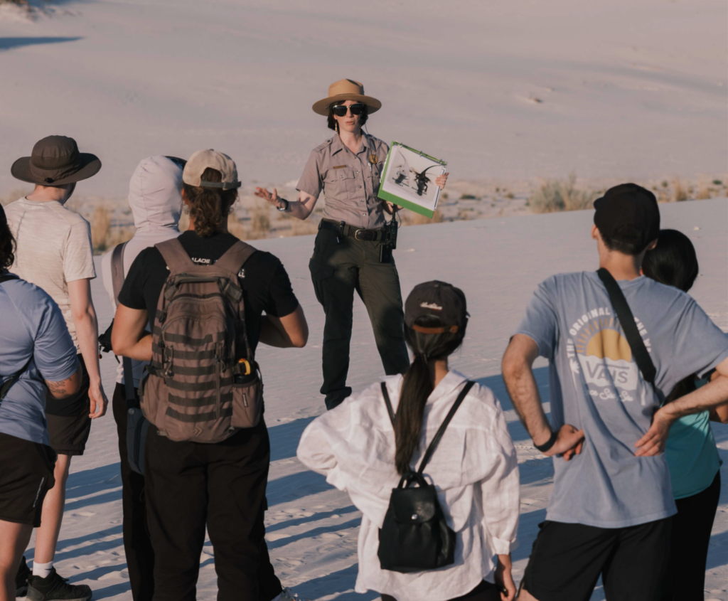 A park ranger leads guests on an interpretive tour at at a national park.