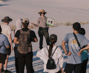 A park ranger leads guests on an interpretive tour at at a national park.